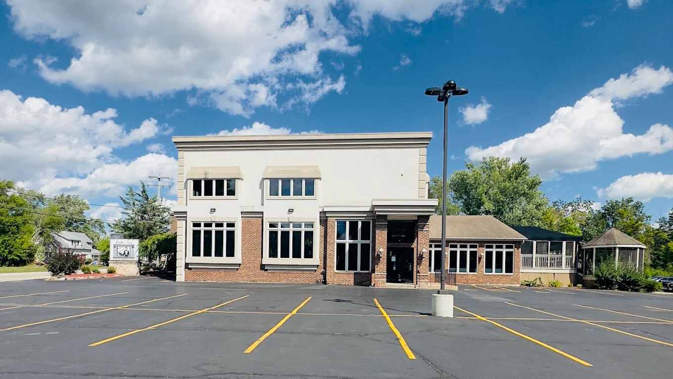 The exterior of the Butler Inn of Pewaukee on a sunny day