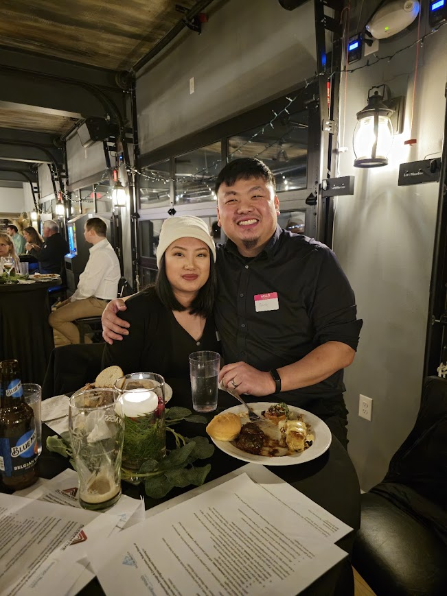 Two attendees sharing a meal at a Local Social event