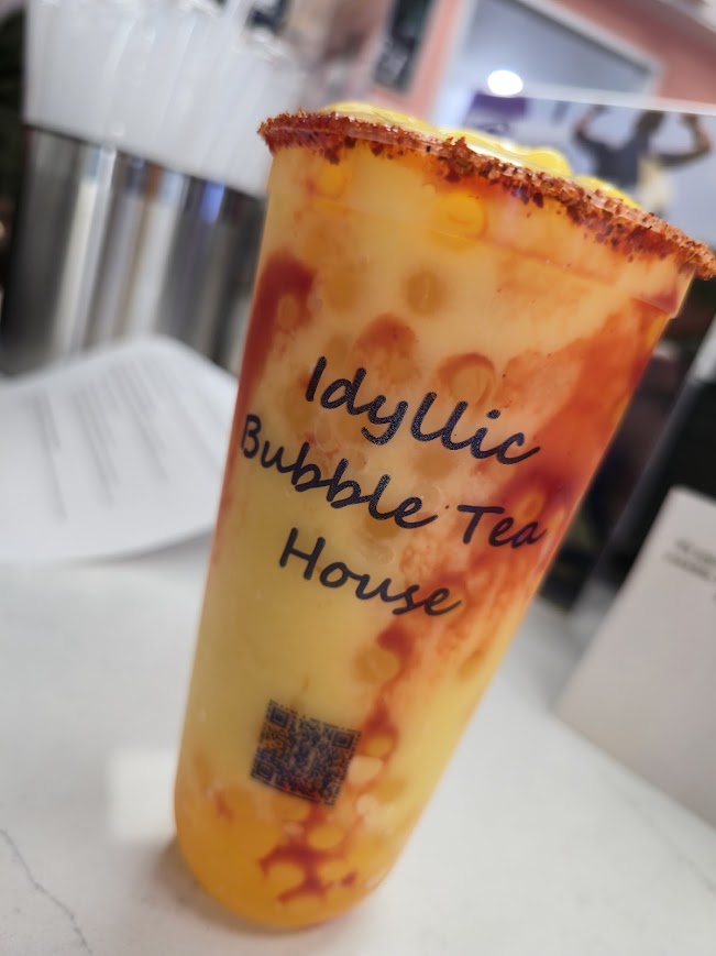 A mango bubble tea cup from Idyllic Bubble Tea House