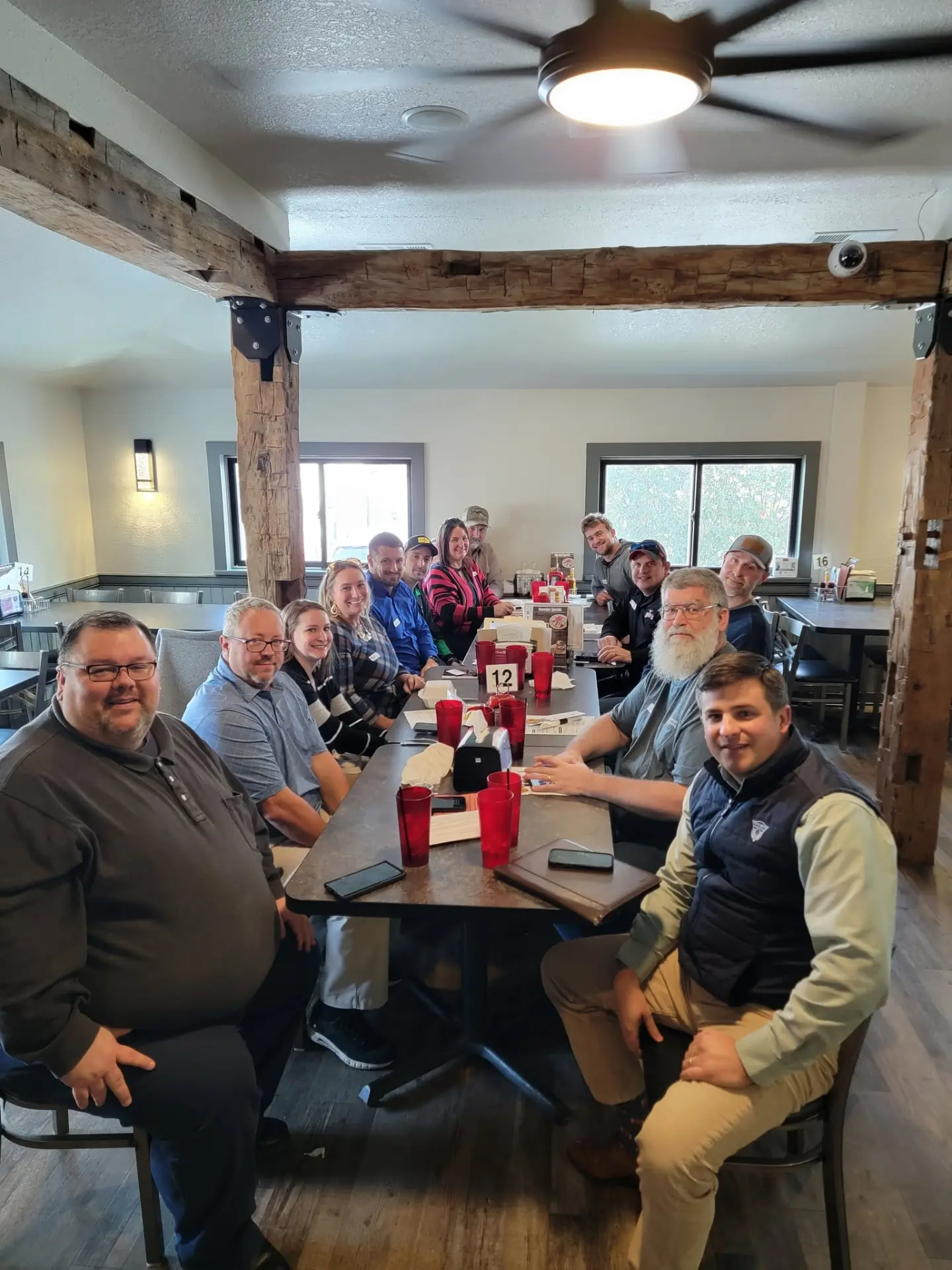 Attendees gathered around a table at Uncle Larry's Rustic Inn