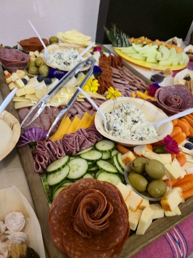 A charcuterie spread of meats, cheeses, olives and vegetables from Lovepacs